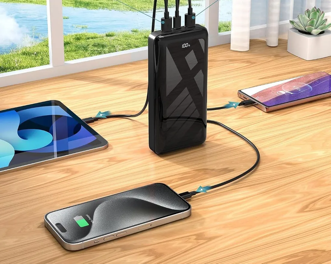 Bextoo 27,000 mAh power bank charging a phone and a tablet at the same time